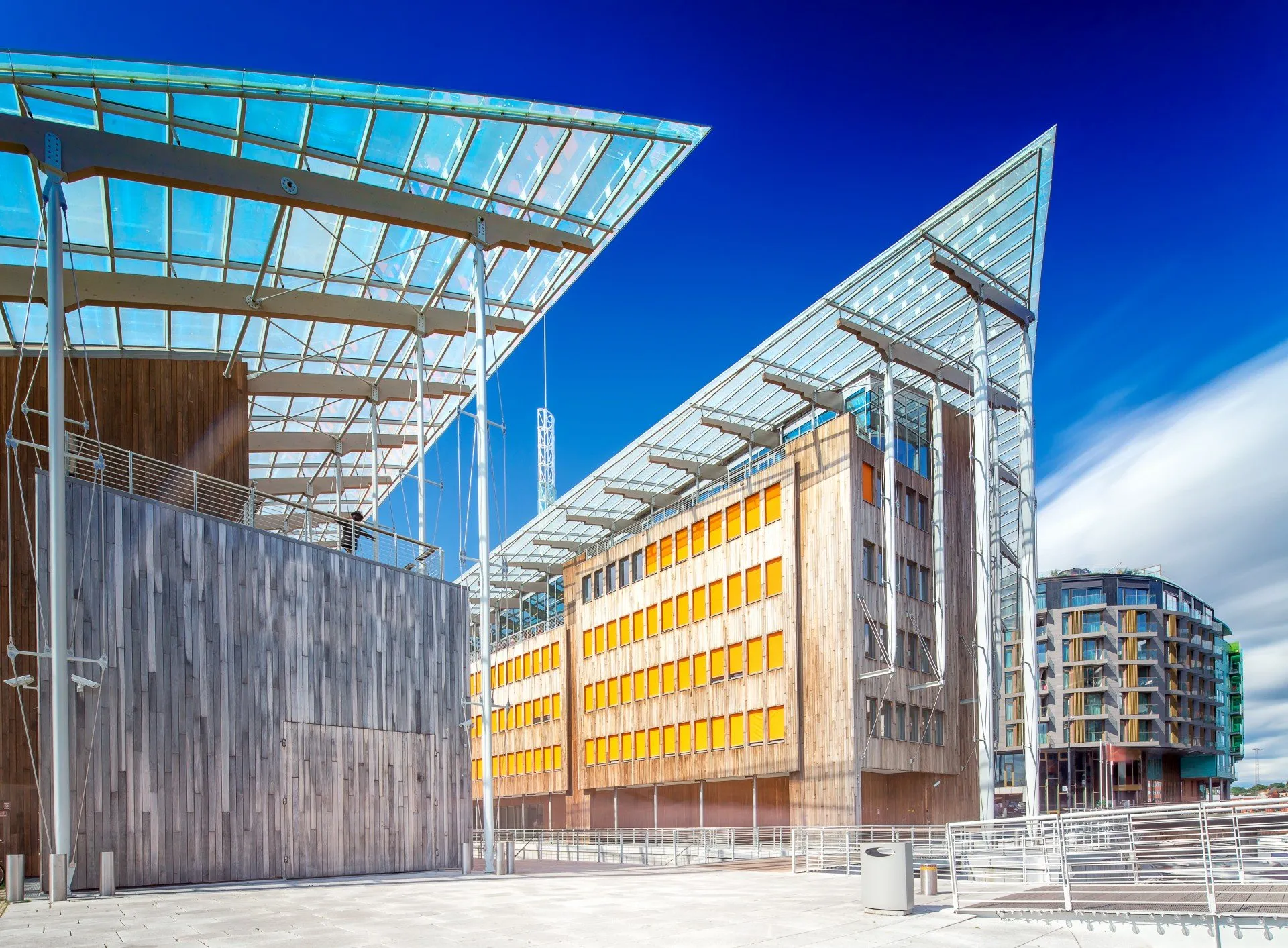 Modern waterfront buildings with glass and wooden design