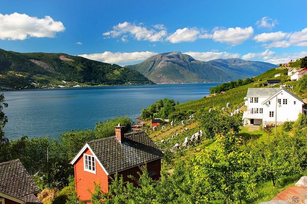 Scenic fjord village with houses and mountains
